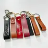 Chaveiro personalizado em couro PU, pulseira de couro para chaves, logotipo em relevo e gravado, pingente de chave em couro para carro