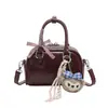Bolso de diseño nicho estilo coreano ins súper popular para mujer, nuevo modelo 2026, alta calidad, exquisito, bolso simple de hombro y cruzado