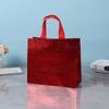 Bolsa no tejida bolsa de regalo transfronteriza en stock suministro precio grande excelente revestida aluminizada bolsa de compras láser