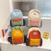 Mochila de viaje para niños de color contrastante, gran capacidad, nuevo estilo de verano 2026, simple, a la moda, versátil, mochila escolar pequeña