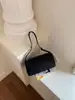 Bolso cilíndrico transfronterizo elegante con estampado de lichi para mujer, nuevo bolso casual de moda 2026 para hombro y crossbody tipo almohada