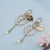 Llavero Colgante Forma de Corazón con Lazo y Perlas Estilo Chanel para Funda de Teléfono Bolso Encanto Regalo Pequeño Accesorios DIY