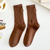 Medias color té con leche suaves tacón elegante bordado pequeño corazón niña calcetines hasta la pantorrilla ins calcetines apilables de celebridad de Internet al por mayor