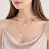 Collar elegante de cadena de serpiente plana con forma de estrella, joyería transfronteriza europea y americana, diseño de nicho femenino, imitación de perla, combina con todo, dulce y moderno.