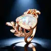 Anel bestseller transfronteiriço em ouro rosé com ramo e gota d'água opala branca, anel vintage oco floral com opala