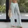 Nuevos pantalones casuales de comercio exterior transfronterizo europeo y americano con estampado de encaje, huecos, transparentes, cintura elástica, pantalones largos tipo falda de moda para vacaciones para mujer
