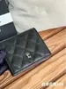 Billetera corta de cuero de vaca de primera capa con patrón de bola de Xiaoxiang, plegable a la mitad, con monedero dentro de la billetera, súper práctica, de alta gama, marca grande