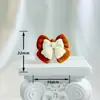 Serie de colores de té de leche de moda accesorios piezas diy pegamento de crema zapatos agujereados materiales de belleza Cabeza de niña cereza oso lindo