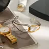 Diseño silencioso acero inoxidable oro de 18 quilates color oro y plata a juego líneas minimalistas pulsera abierta hueca anudada en espiral