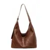 Colección de otoño 2026 transfronteriza: bolso bandolera retro de estilo nicho para mujer, versátil bolso con forma de dumpling, bolso de hombro moderno y práctico para ir al trabajo