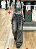 Chao Li tiene en stock jeans desgastados rotos para mujer, nuevo estilo de verano 2026, pantalones de pierna ancha rectos con panel trasero de cuadros