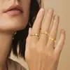 Amazon Xiyin Anillos Giratorios para Pareja de Acero de Titanio Esmaltado con Diamantes de Zirconia para Alivio del Estrés Juego de 7 Joyas