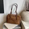 Bolsa feminina de grande capacidade 2026 nova bolsa de ombro casual nicho vintage com toque de alta qualidade para trabalho e deslocamento, bolsa tipo travesseiro