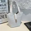 Otoño 2026 Nuevo Retro Gran Capacidad Textura de Alta Calidad Elegante Textura Tejida Simple Versátil Bolso de Cubo de Mano Cruzado