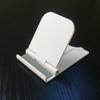 Soporte de escritorio para teléfono móvil, creativo, simple, portátil, plegable, multiusos, pequeño marco de soporte, base perezosa