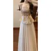 Nuevo Traje de Chaleco Dorado Estilo Chino Nacional con Falda para Mujer, Moda de Verano Conjunto de Dos Piezas de Top Botonado de Gama Alta y Falda Media