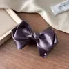 Pinza tipo banana con lazo de estilo coreano de alta gama para una elegante coleta, nueva pinza vertical retorcida 2026 para mujer.