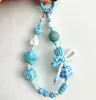 Corrente de celular com pingente de coração e rosto sorridente de dopamina, pulseira de miçangas com laço, corrente de pulso Xiaohongshu, pingente para bolsa, câmera e garrafa de água