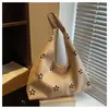Bolso de axila de nicho para mujer, nuevo bolso de hombro hueco estilo coreano de moda 2026, bolso tote versátil para el día a día