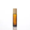 Botella roller de aceite esencial de 5 ml con tapa de veta de madera, botella roller de perfume, botella de aceite esencial a prueba de luz color té, botella vacía de aceite esencial dispensadora de perfume