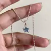 Collar de clavícula con estrella de cristal azul helado y cadena de bambú plateada, un accesorio versátil que irradia un encanto suave y juvenil