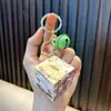 Woan coolomi llavero colgante cubo de Rubik al por mayor mini portátil cubo de Rubik colgante juguete educativo