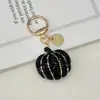 Novo Chaveiro de Abóbora com Pedraria de Cerâmica e Strass Bordados Transfronteiriços Halloween Criativo Pingente de Bolsa de Luxo Leve Acessórios de Enfeites Feitos à Mão