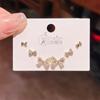 2024 Nuevos exquisitos aretes de botón simples personalizados de lazo, tres pares, para mujer, aguja de plata, estilo coreano, juego de 6 piezas