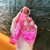 Llavero creativo de calavera de copo de nieve relleno de aceite, lindo colgante de arena movediza líquida, accesorio para bolso, venta al por mayor de regalos pequeños