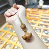 Peonza de madera de azufaifo, cadena para teléfono móvil, colgante de bolsa para peonza, llavero, correa colgante anti-pérdida de gran venta