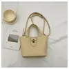 Bolsa Única com Textura Pequena Tote Bag para Mulheres 2026 Nova Bolsa Simples de Balde Versátil Bolsa de Ombro Transversal Conjunto
