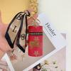 Monedero de lujo de alta calidad con colgante para auriculares, minibolso con llavero de lápiz labial, bolso retro con forma de cubo, bolso con lápiz labial, colgante sencillo.