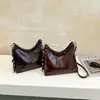 Nueva colección otoño/invierno 2026: Bolso de mano coreano simple, retro, moderno y versátil con un toque de alta gama, diseñado para mujeres, y se puede llevar como bandolera o bolso de hombro