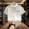 Camisa polo para hombre de verano, moda británica casual, corte slim, retro, versátil, estilo coreano, moderna, estampada, con cuello vuelto, manga corta