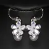 Moda europea y americana en vivo nuevo traje de pendientes de perlas INS Corea del Sur pendiente con gancho de oreja pendientes de flor de temperamento