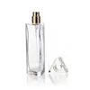 Botella de perfume triangular de vidrio transparente con pulverizador fino de bayoneta 30ml50ml cuerpo de botella de vidrio dividido en botellas vacías