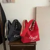 Bolso de Lona Rayado de Gran Capacidad para Mujer 2026 Nuevo Estilo Coreano Bolso de Hombro para el Trabajo Bolso Tote Versátil Casual para la Universidad