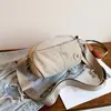 Bolso cruzado de estilo simple para mujer 2026 Nuevo versátil ligero impermeable de nailon para el día a día Bolso de viaje multicapa para teléfono