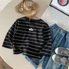 Camiseta de Manga Larga para Niños Otoño 2026 Nuevo Estilo Niños y Niñas Capa Base Rayada Estilo Coreano Algodón Puro Camiseta Bebé Top Versátil