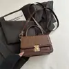 Bolsa quadrada pequena de trama 2026 nova bolsa de ombro moderna bolsa simples feminina pequena bolsa de mão bolsa feminina de comércio exterior bolsa transversal