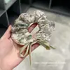 Selección PremiumElásticos elegantes y con estilo, nueva colección de accesorios para el cabello de nicho de alta gama para recoger el cabello en la parte posterior de la cabeza