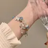 Pulsera de mariposa con diseño de libro rojo y flores explosivas, nueva pulsera de hadas china de moda para el cumpleaños de tu novia.