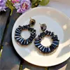 Aretes redondos Dopamine con incrustaciones de agujas plateadas y diamantes, lujo ligero, moda de alta gama, aretes exquisitos con un diseño único, aretes de nicho para mujer