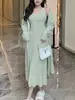 Traje Elegante Estilo Francês para Mulheres 2025 Outono e Inverno Novo Conjunto de Duas Peças: Cardigan de Tricô Longo e Saia de Alça Longa até o Joelho