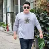 Nueva camiseta de manga larga para primavera y otoño para hombre, camiseta básica de talla grande, cuello redondo extra grande, corte holgado para hombres grandes y corpulentos, ropa de otoño al por mayor