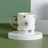 Estación independiente etiquetado transfronterizo en nombre de la taza de café de cerámica de moda ojo del diablo taza de café tendencia europea juego de platillo