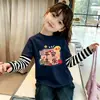 Camiseta de algodão puro para meninas, patchwork, gola redonda, manga longa, novo estilo fino para primavera e outono de 2026, top versátil de desenho animado para crianças mais velhas