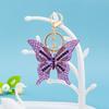 Moda coreana serie de diamantes de colores cadena de llaves colgante mariposa hueca de aleación de diamantes completos accesorios para bolso regalo al por mayor