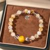 Diseño pulsera de cristal amarillo placa serpiente transferencia cuentas pulsera oro piedra ojo de tigre joyería de alto sentido joyería de cristal al por mayor