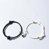 Pulsera de amor blanco y negro transfronteriza piedra de los deseos amantes pulsera costura corazón roto magnética tejida ajustable cuerda de mano hombres y mujeres Venta al por mayor